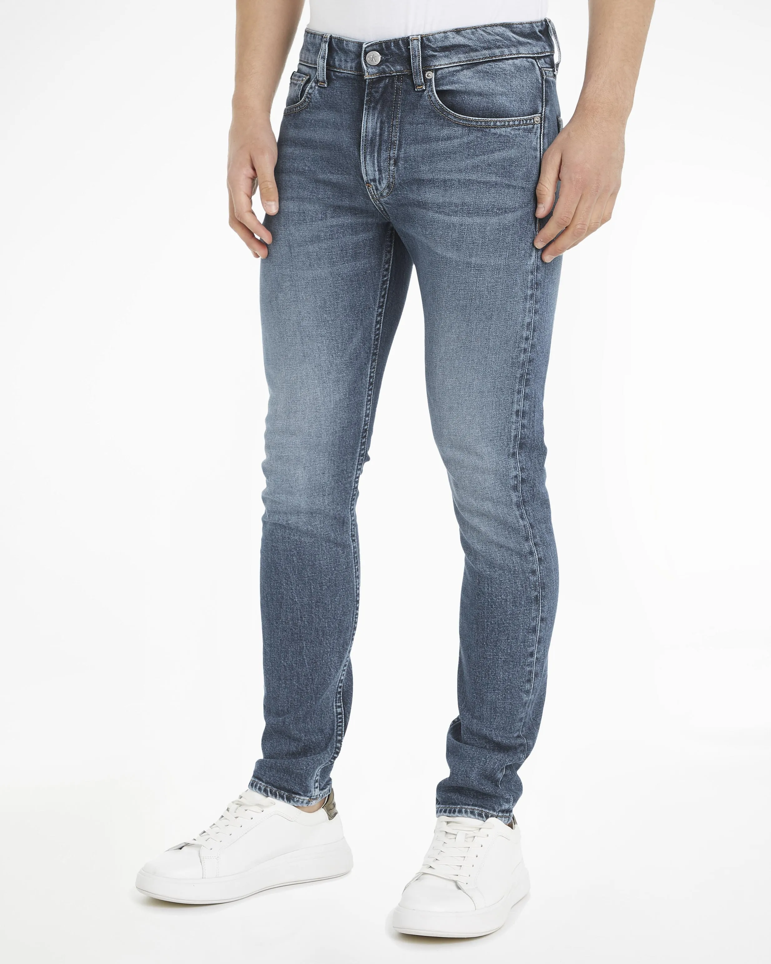 Jeans slim tapered-fit in cotone stretch lavaggio medio stone washed con baffature